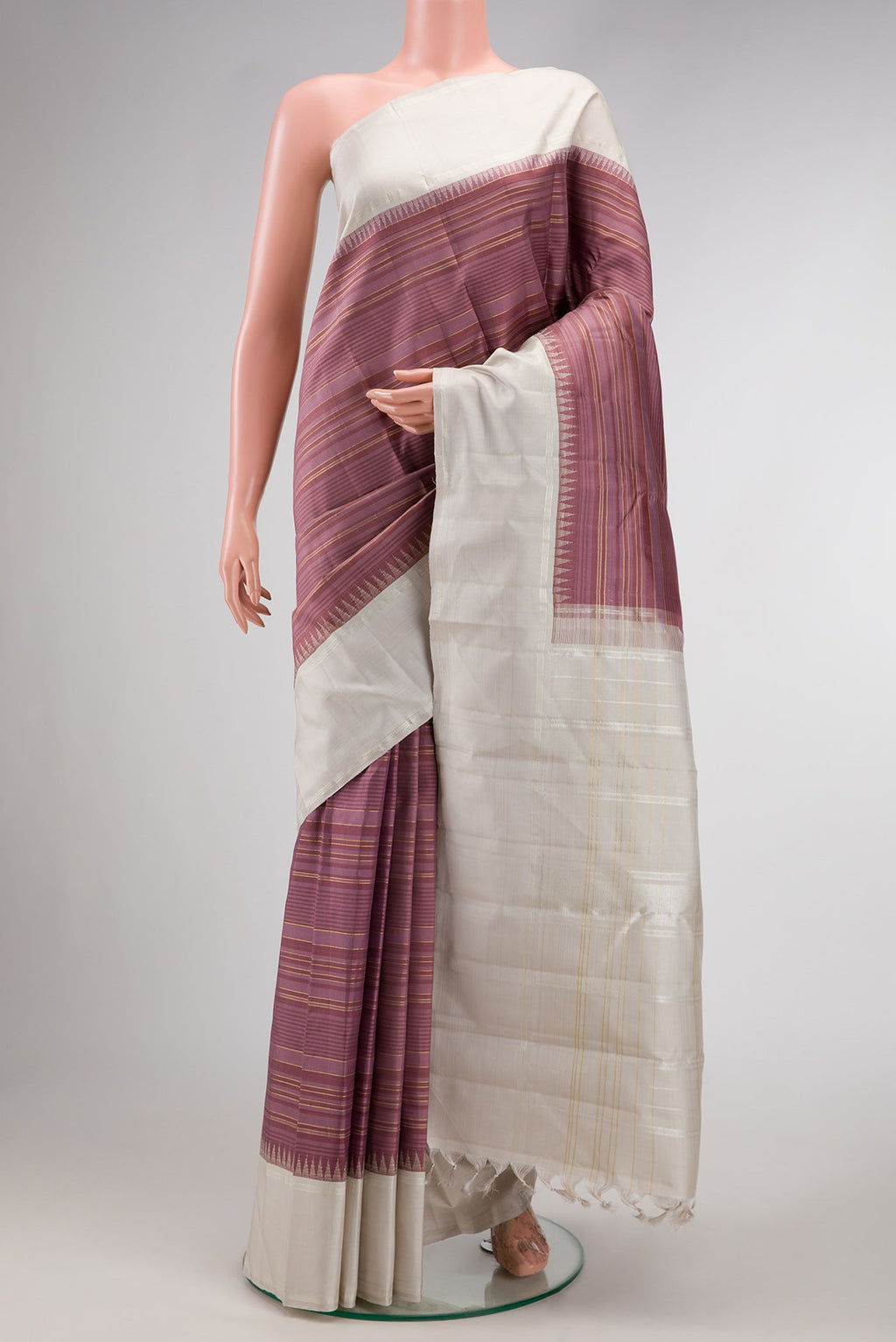 Purple Dual Tone Kanjivaram Silk Saree with Stripes on the body and Zari Border.  displayed on a mannequin
