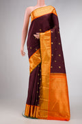 Coffee Brown Dual Tone Kanjivaram Silk Saree with Zari Butta on the body and Zari Border.  displayed on a mannequin