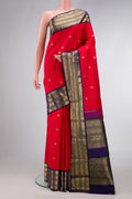 Red Dual Tone Kanjivaram Silk Saree with Zari Butta on the body and Zari Border.  displayed on a mannequin