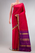 Red Dual Tone Kanchipuram Silk Saree with Zari Butta on the body and Zari Border.  displayed on a mannequin