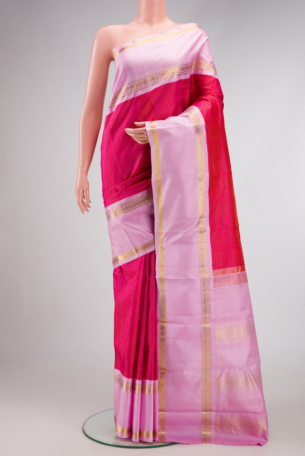 Pink Dual Tone Kanjivaram Silk Saree with Checked design on the body and Zari Border.  displayed on a mannequin