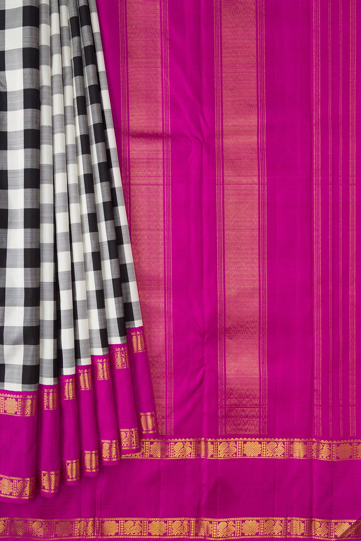 Pleats and pallu of White and Black Color Kanjivaram Silk Saree with Checked design on the body and Zari Border. 