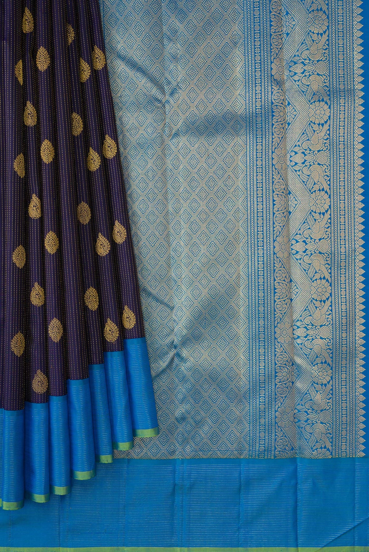 Pleats and pallu of Navy Blue Dual Tone Kanjivaram Silk Saree with Zari Butta on the body and Zari Border. 
