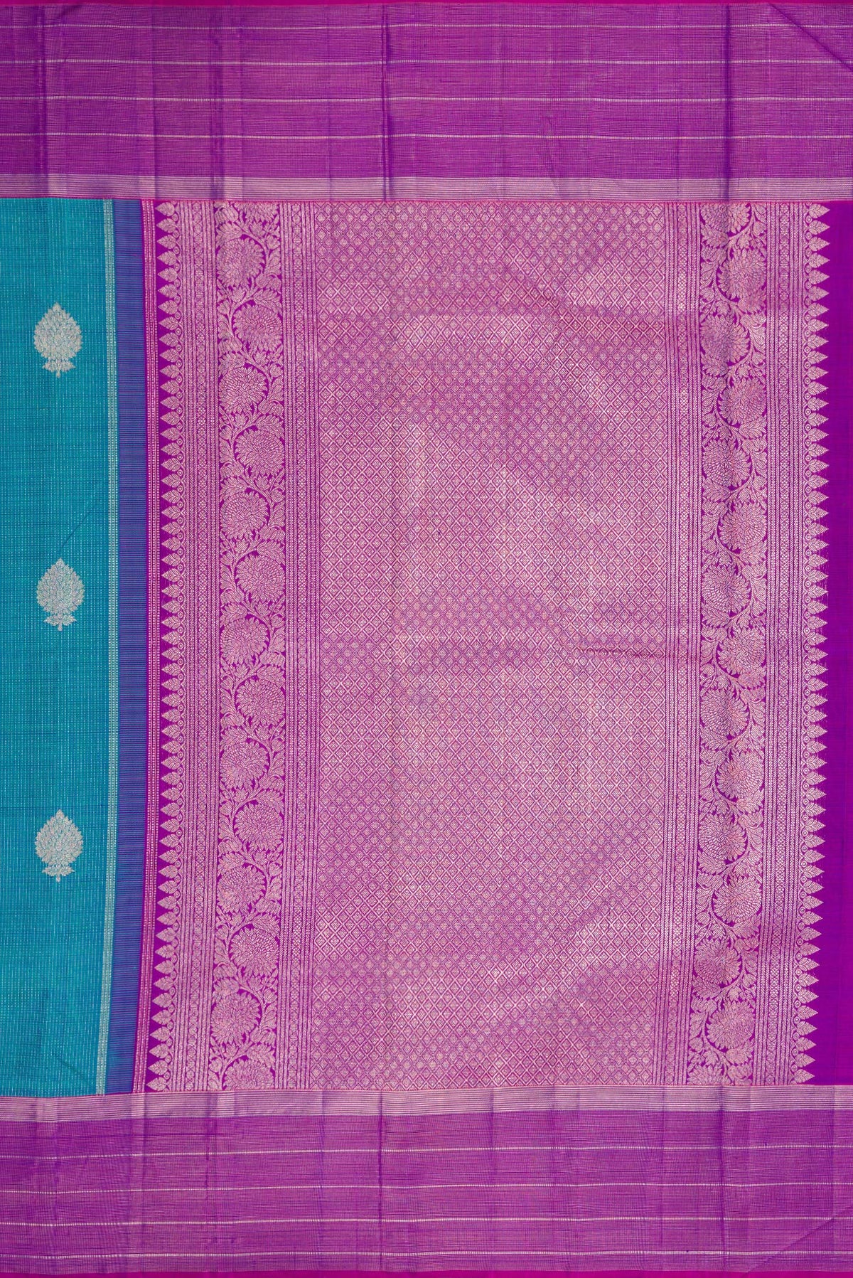 Close up image of the pallu of Peacock Blue Dual Tone Kanjivaram Silk Saree with Zari Butta on the body and Zari Border. 