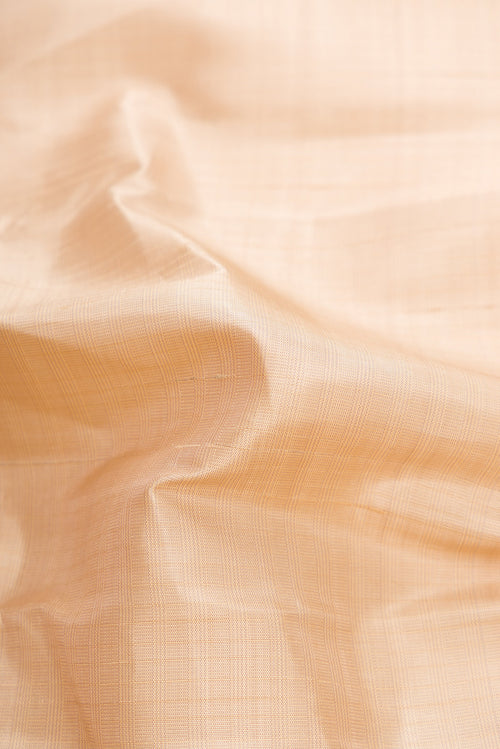 Close up of Beige Kanjivaram Silk Saree with Checked design on the body and Plain Border.  displaying folds