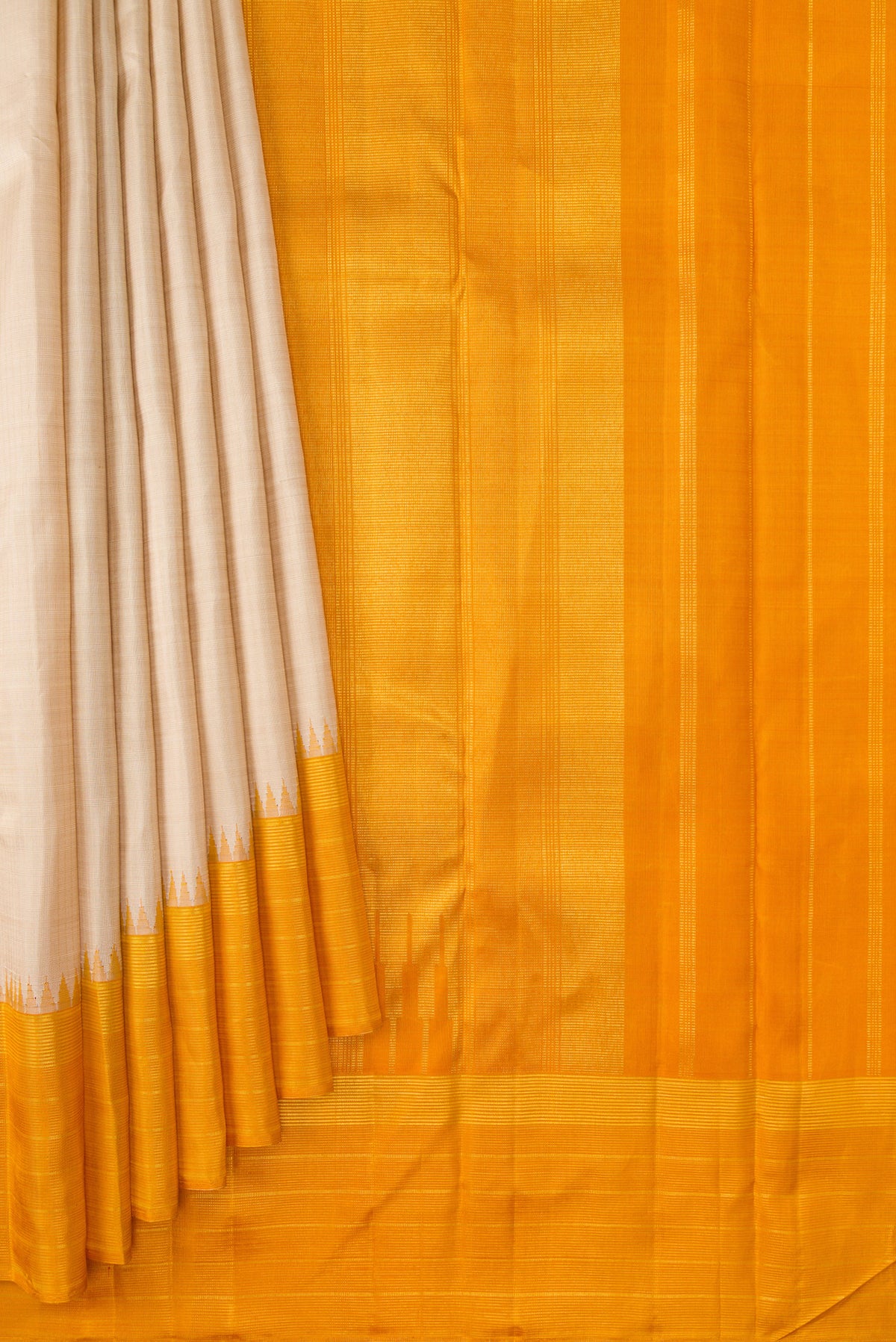 Pleats and pallu of Beige Kanjivaram Silk Saree with Checked design on the body and Plain Border. 