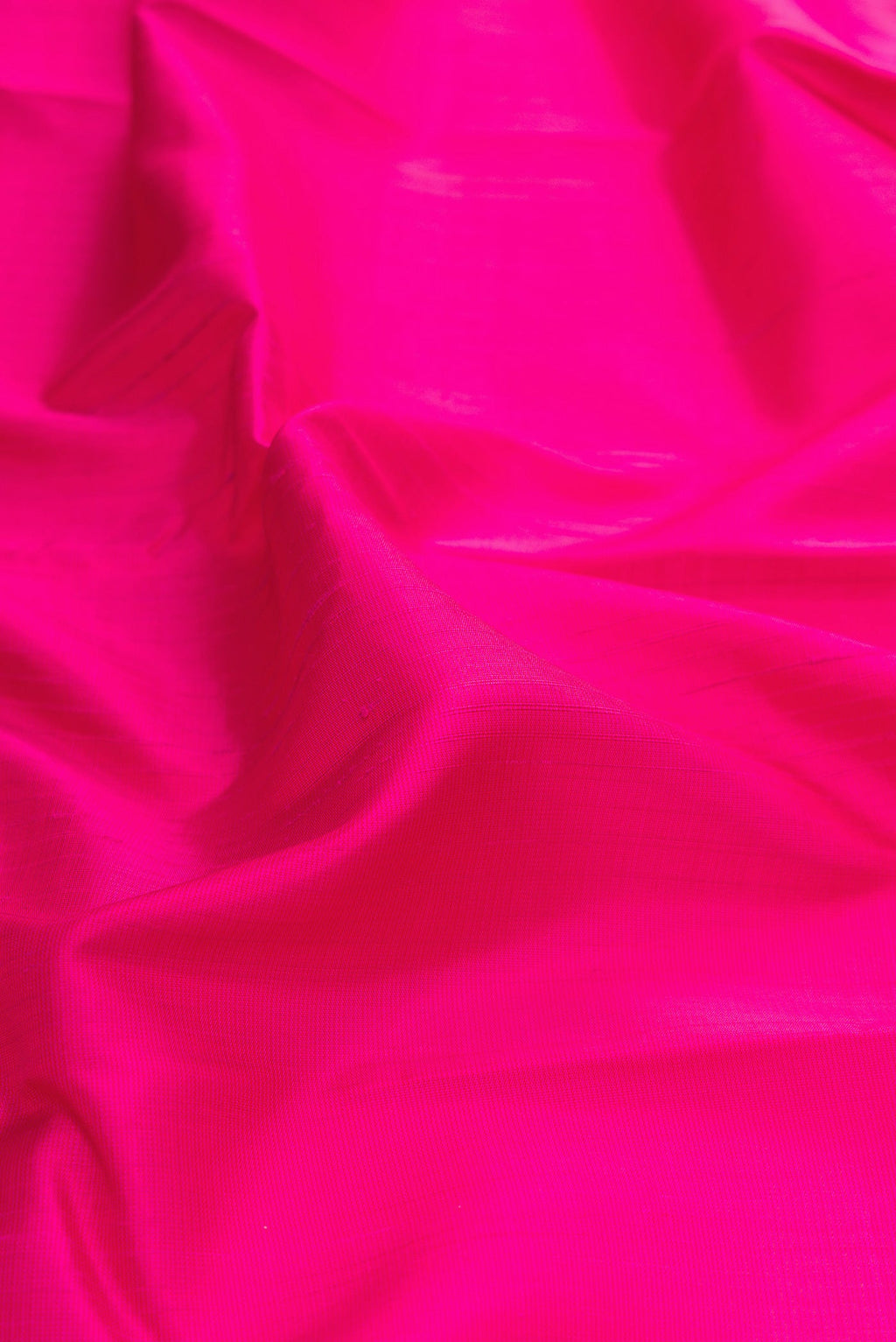 Close up of Pink Dual Tone Kanjivaram Silk Saree with Plain Body and Temple Border.  displaying folds