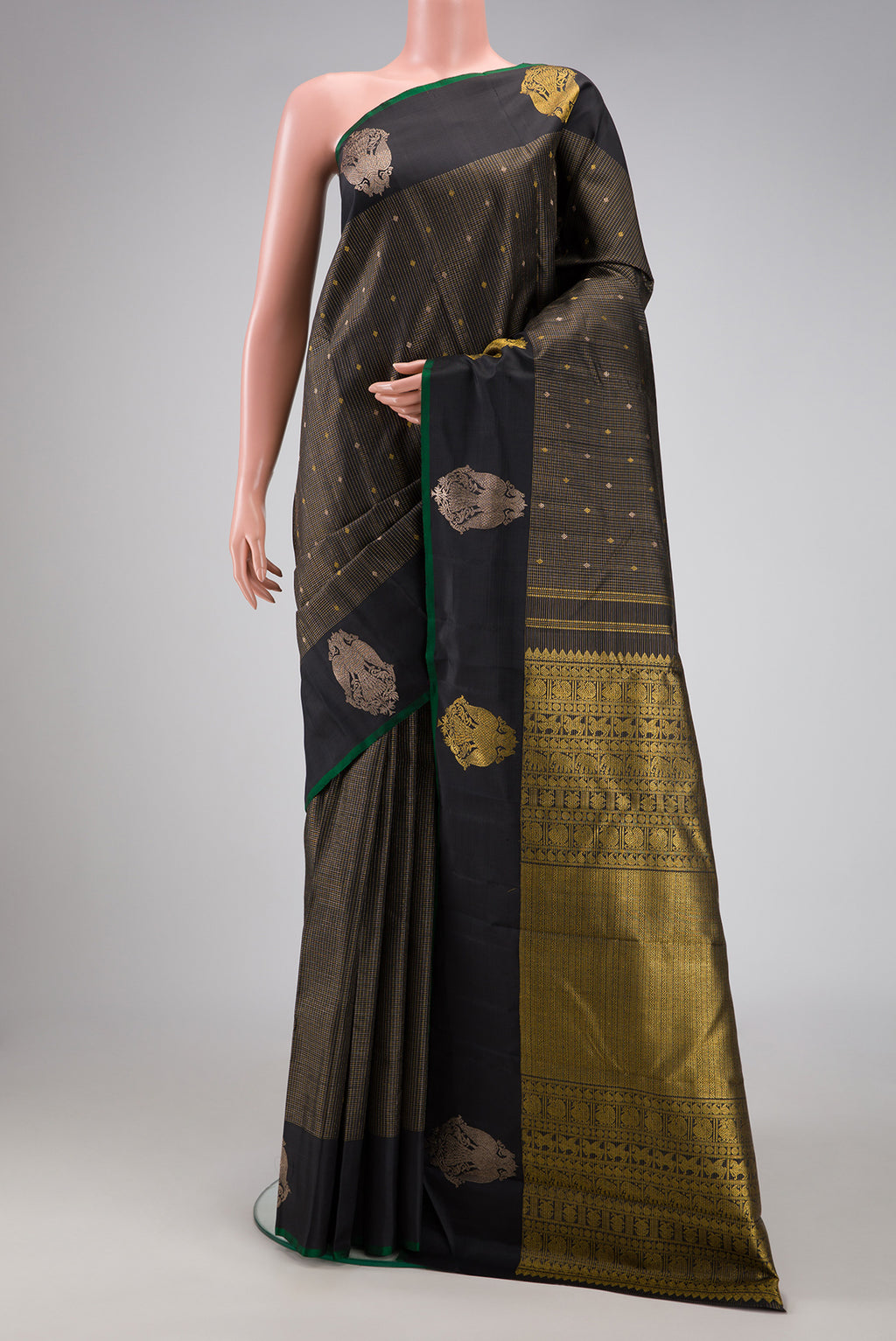 Black Kanjivaram Silk Saree with Checked design on the body and Fancy Border.  displayed on a mannequin