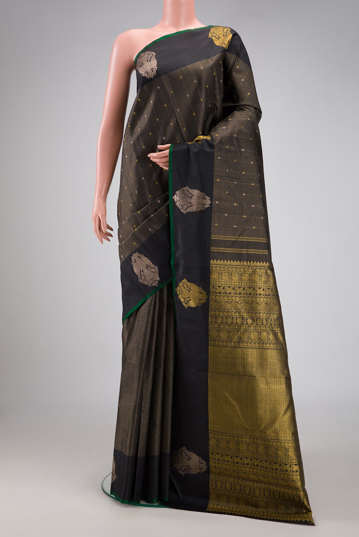 Black Kanjivaram Silk Saree with Checked design on the body and Fancy Border.  displayed on a mannequin