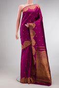 Magenta Dual Tone Kanjivaram Silk Saree with Zari Butta on the body and Fancy Border.  displayed on a mannequin