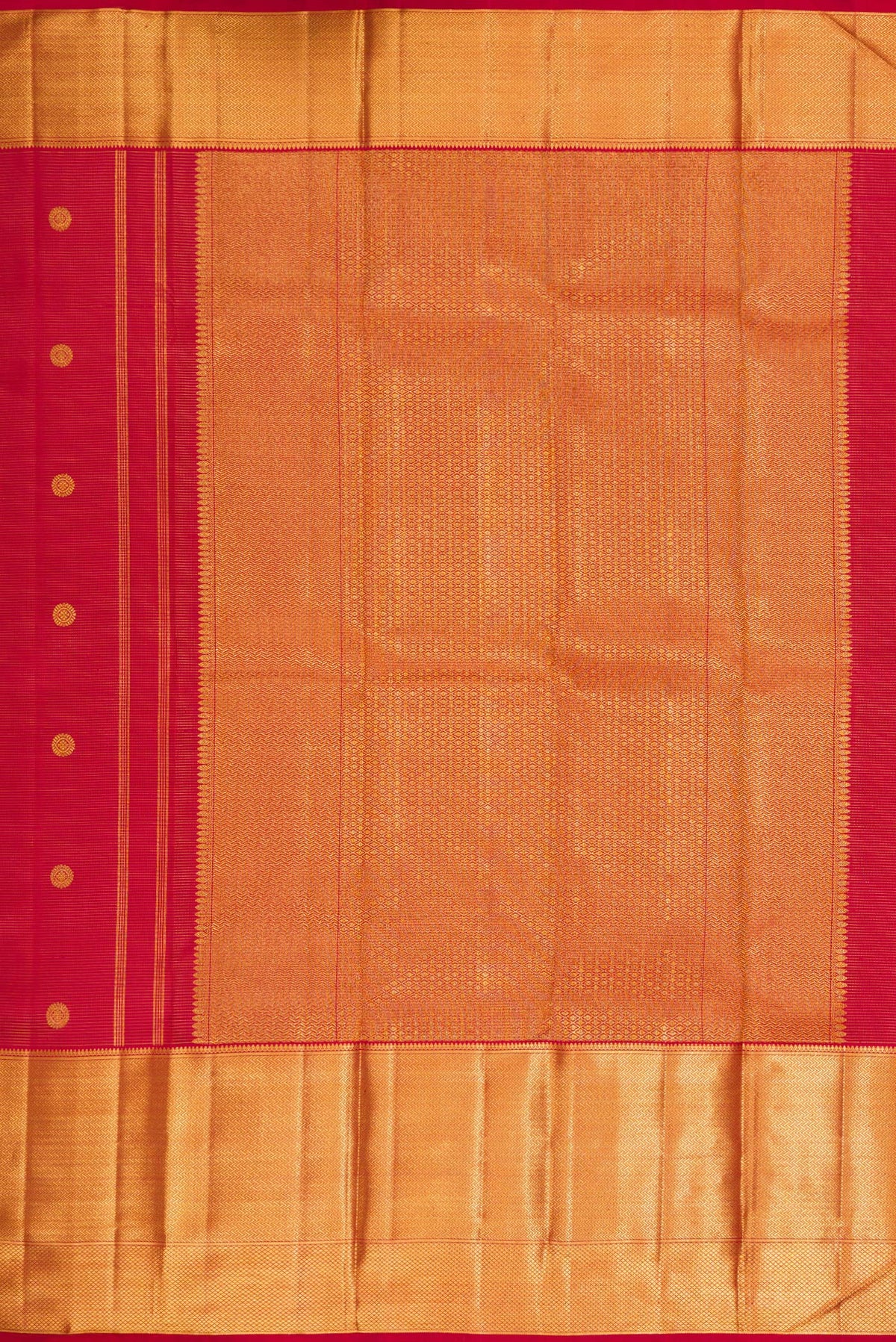 Close up image of the pallu of Red Kanchipuram Silk Saree with Zari Butta on the body and Zari Border. 