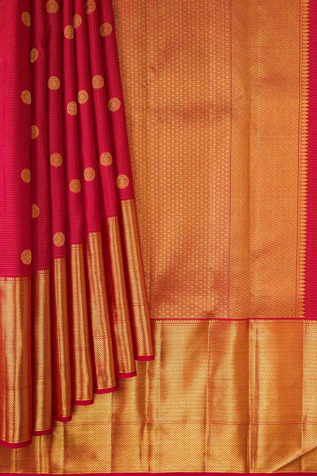 Pleats and pallu of Red Kanchipuram Silk Saree with Zari Butta on the body and Zari Border. 