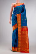Sky Blue Dual Tone Gadwal Silk Saree with Zari Butta on the body and Zari Border.  displayed on a mannequin