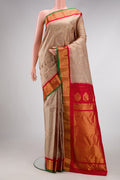 Beige Dual Tone Gadwal Silk Saree with Zari Butta on the body and Zari Border.  displayed on a mannequin