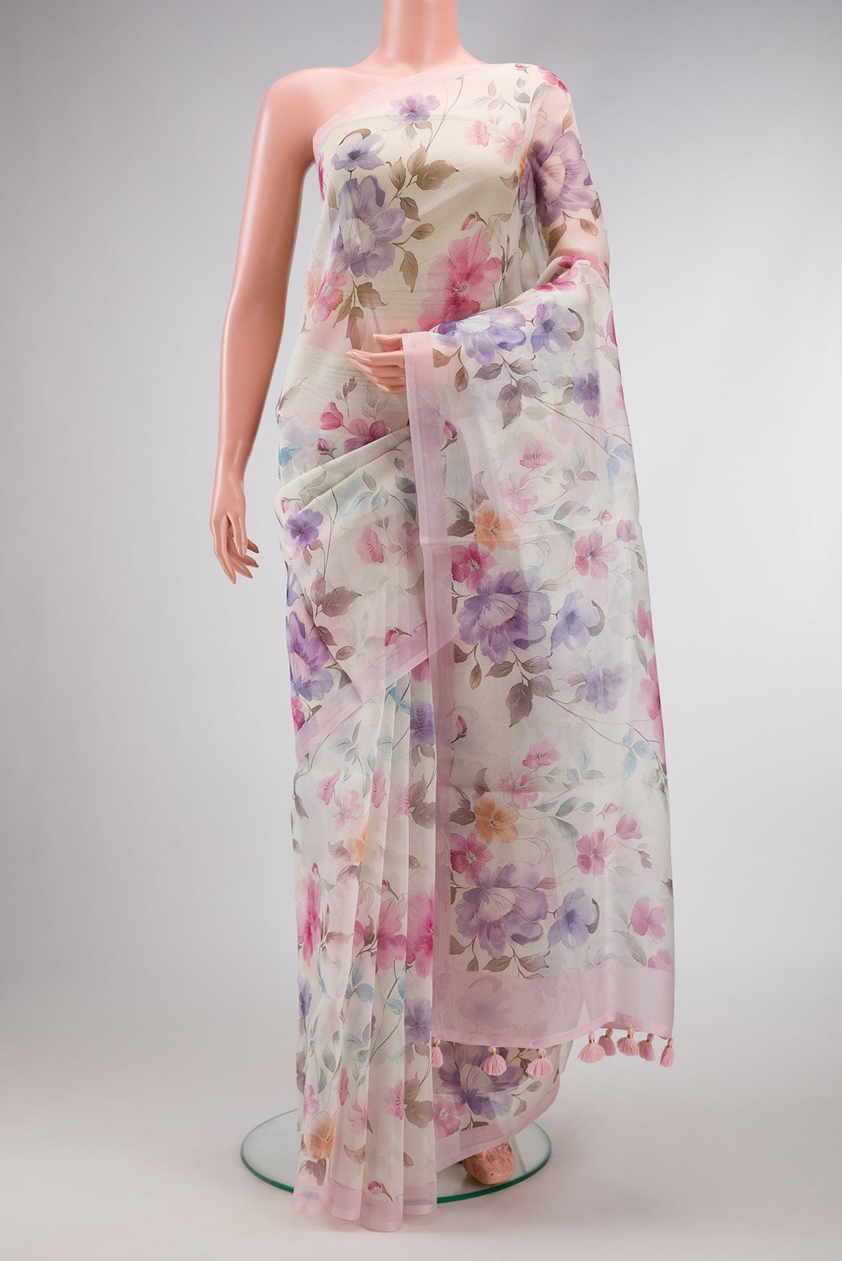 Off White Dual Tone Organza Silk Saree with Printed design on the body and Plain Border.  displayed on a mannequin