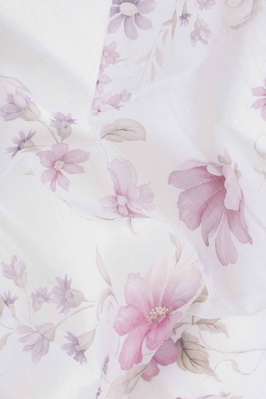 Close up of White Dual Tone Mysore Chiffon Saree with Printed design on the body and Plain Border.  displaying folds