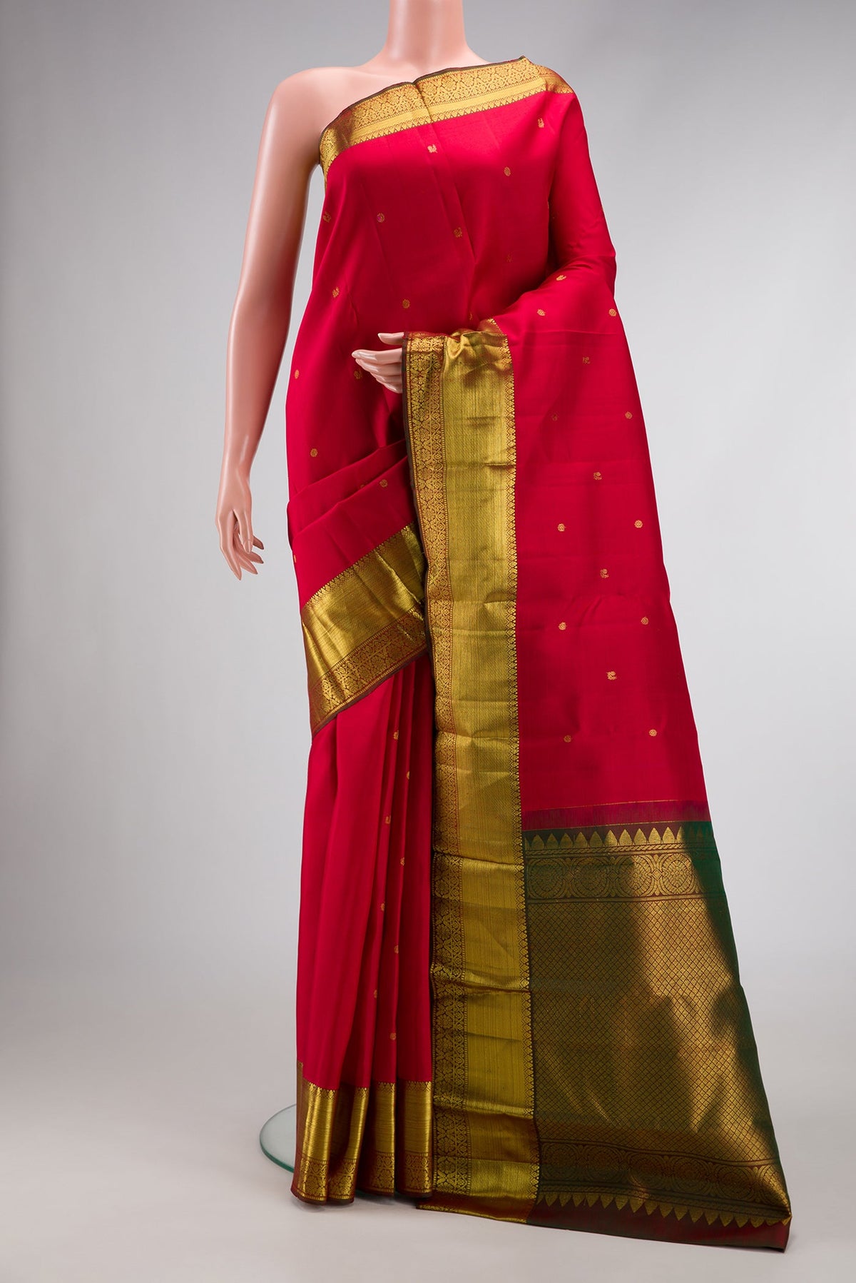 Red Dual Tone Kanjivaram Silk Saree with Zari Butta on the body and Zari Border.  displayed on a mannequin