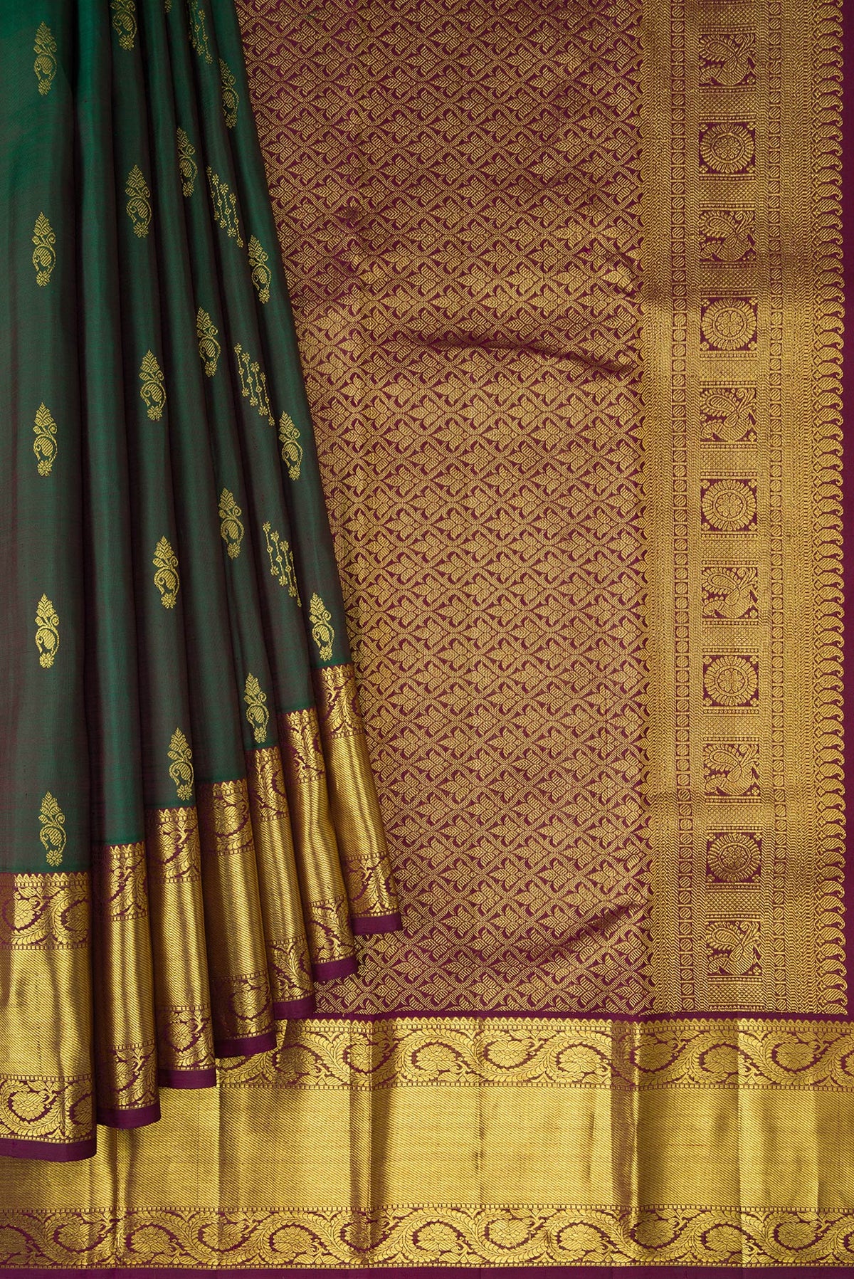 Pleats and pallu of Bottle Green Dual Tone Kanjivaram Silk Saree with Zari Butta on the body and Zari Border. 