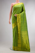 Light Green Dual Tone Kanjivaram Silk Saree with Zari Butta on the body and Zari Border.  displayed on a mannequin