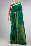 Green Dual Tone Kanjivaram Silk Saree with Zari Butta on the body and Zari Border.  displayed on a mannequin