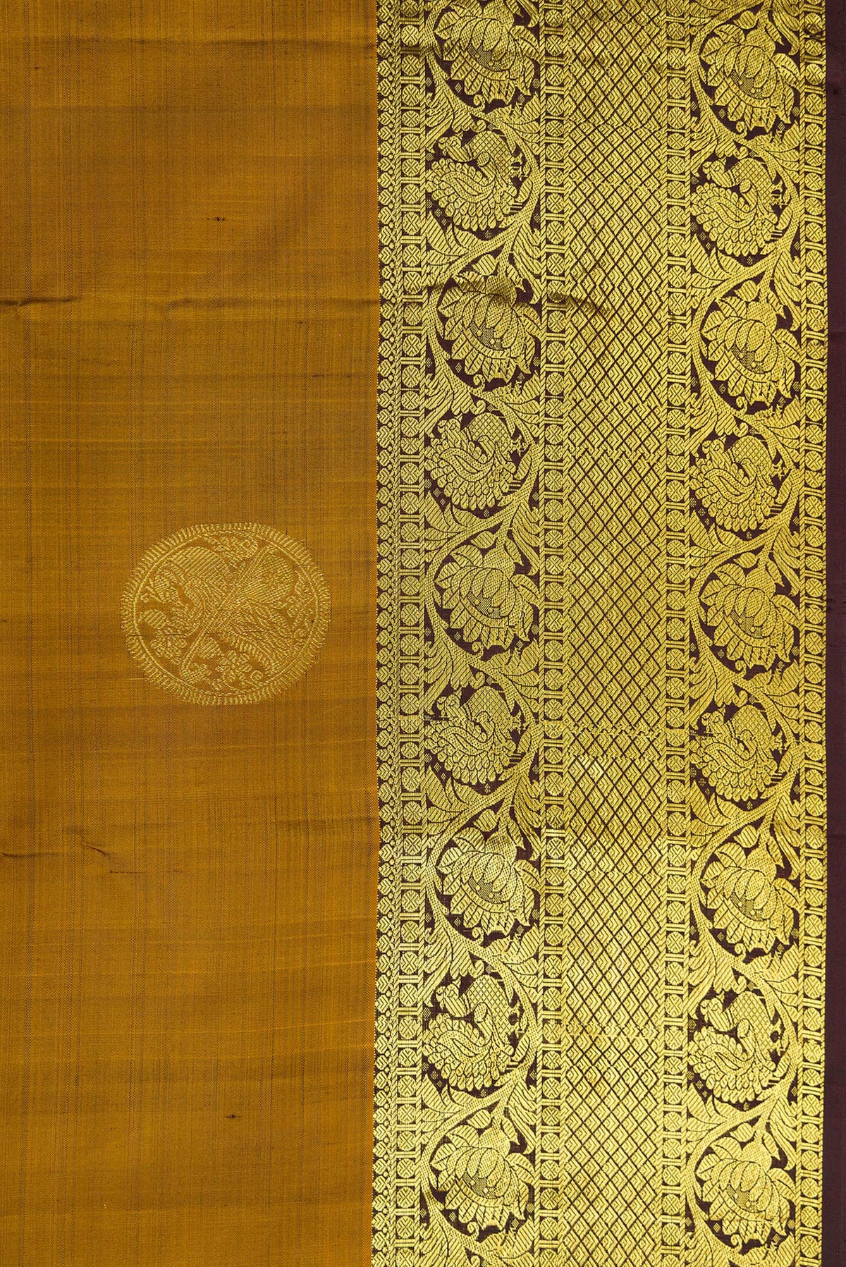 Border image of Gold Dual Tone Kanjivaram Silk Saree with Zari Butta on the body and Zari Border. 