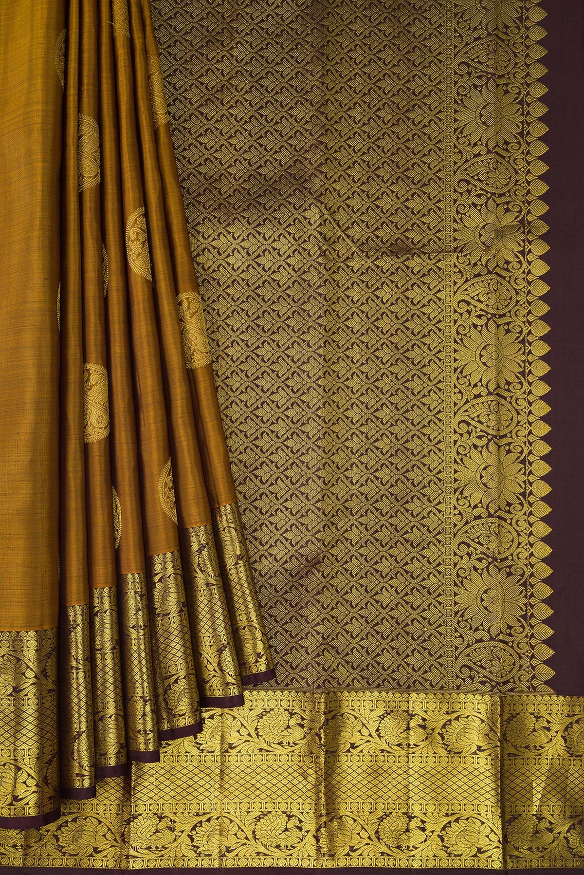 Pleats and pallu of Gold Dual Tone Kanjivaram Silk Saree with Zari Butta on the body and Zari Border. 