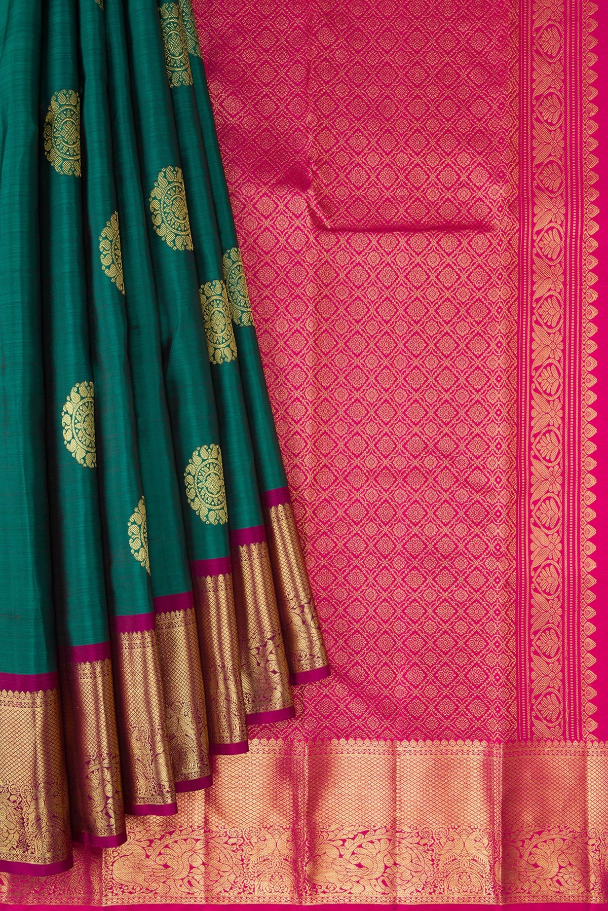 Pleats and pallu of Bottle Green Dual Tone Kanjivaram Silk Saree with Zari Butta on the body and Zari Border. 