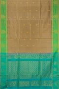 Dark Beige Soft Silk Saree with Zari Butta on the body and Zari Border.  displayed on a mannequin