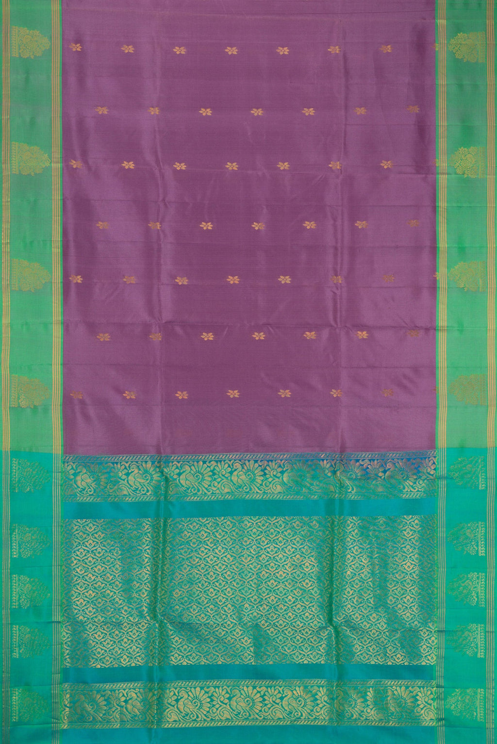 Lilac Soft Silk Saree with Zari Butta on the body and Zari Border.  displayed on a mannequin