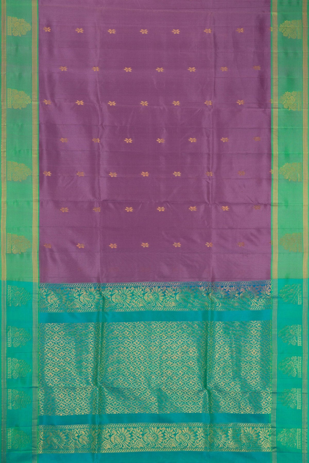 Lilac Soft Silk Saree with Zari Butta on the body and Zari Border.  displayed on a mannequin