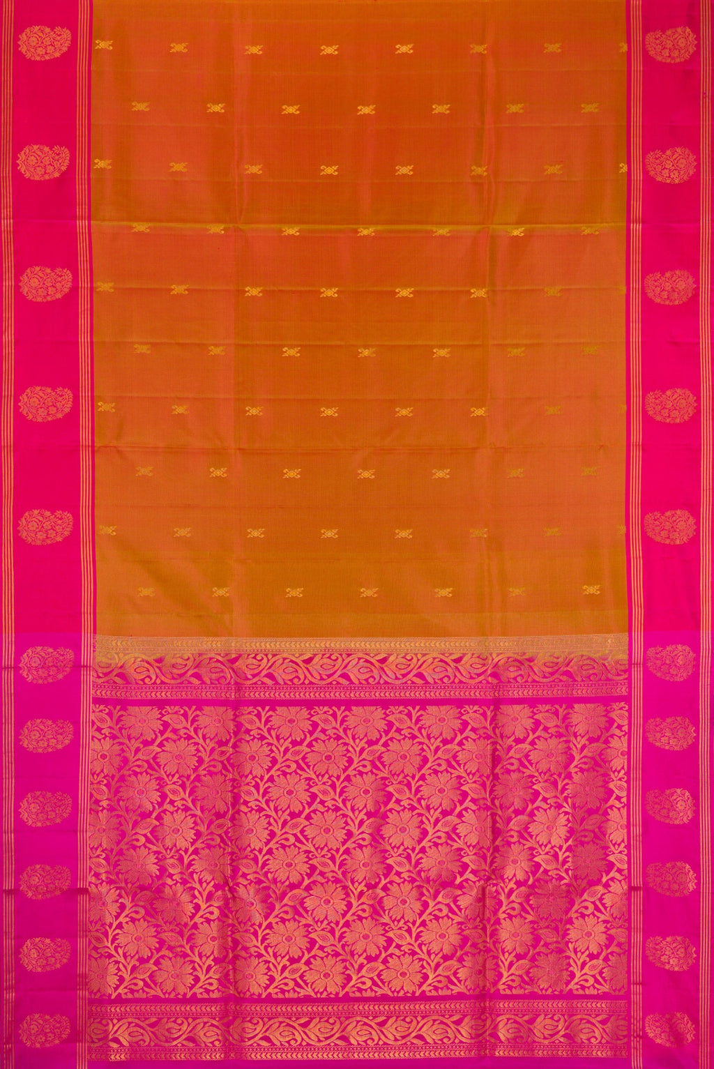 Brick Orange Dual Tone Soft Silk Saree with Zari Butta on the body and Fancy Border.  displayed on a mannequin