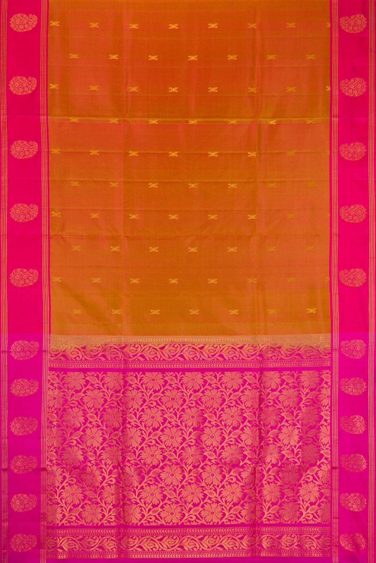 Flat view of Brick Orange Dual Tone Soft Silk Saree with Zari Butta on the body and Fancy Border. 