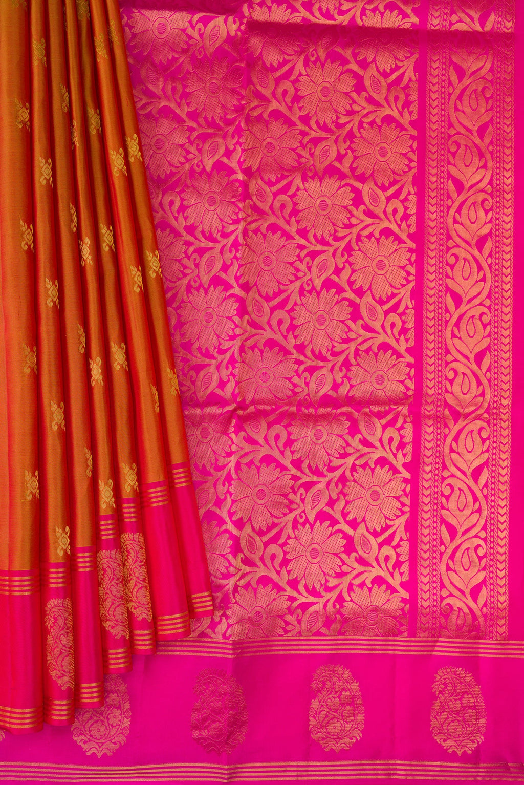 Pleats and pallu of Brick Orange Dual Tone Soft Silk Saree with Zari Butta on the body and Fancy Border. 