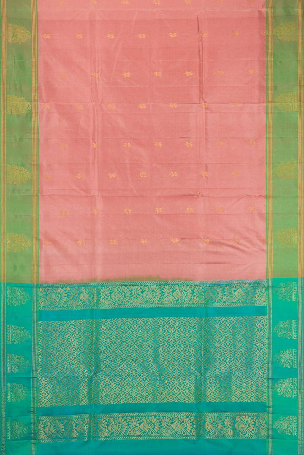 Rose Gold Soft Silk Saree with Zari Butta on the body and Fancy Border.  displayed on a mannequin