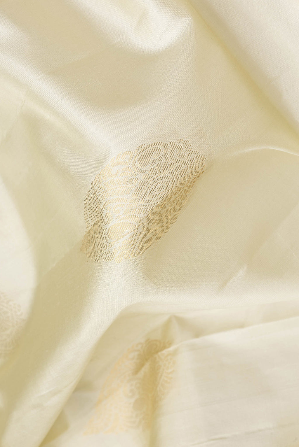 Close up of Pista Green Dual Tone Soft Silk Saree with Zari Butta on the body and Zari Border.  displaying folds