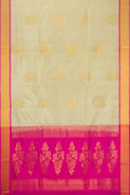 Beige Soft Silk Saree with Zari Butta on the body and Zari Border.  displayed on a mannequin