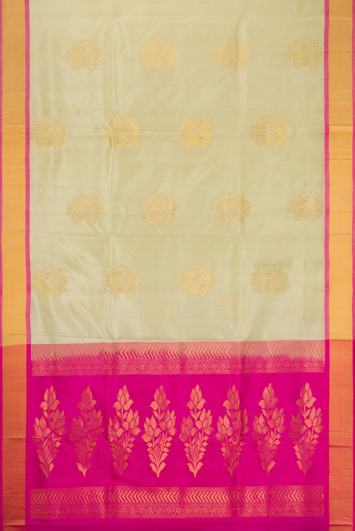 Flat view of Beige Soft Silk Saree with Zari Butta on the body and Zari Border. 