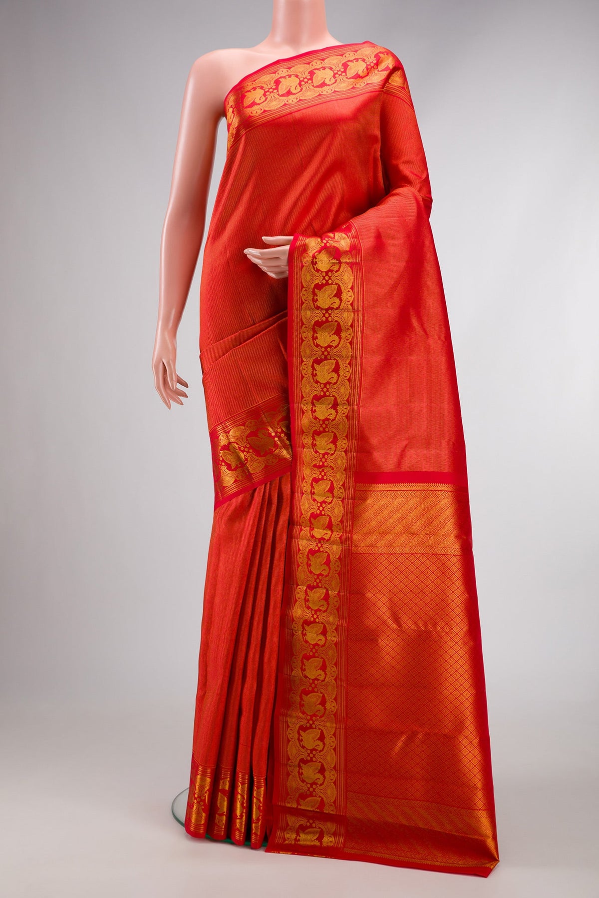 Red Dual Tone Kanchipuram Silk Saree with Zari Brocade on the body and Zari Border.  displayed on a mannequin