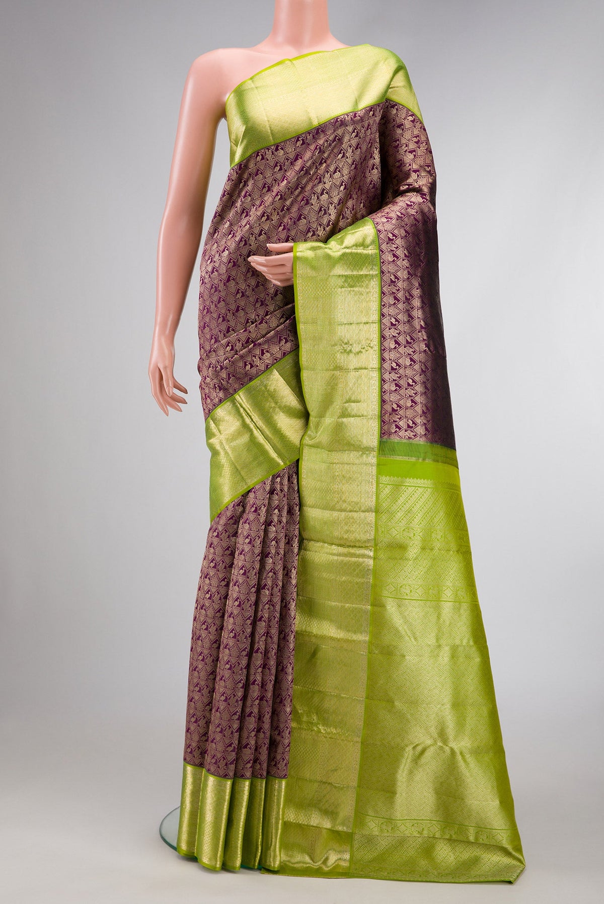 Magenta Dual Tone Kanchipuram Silk Saree with Zari Brocade on the body and Zari Border.  displayed on a mannequin