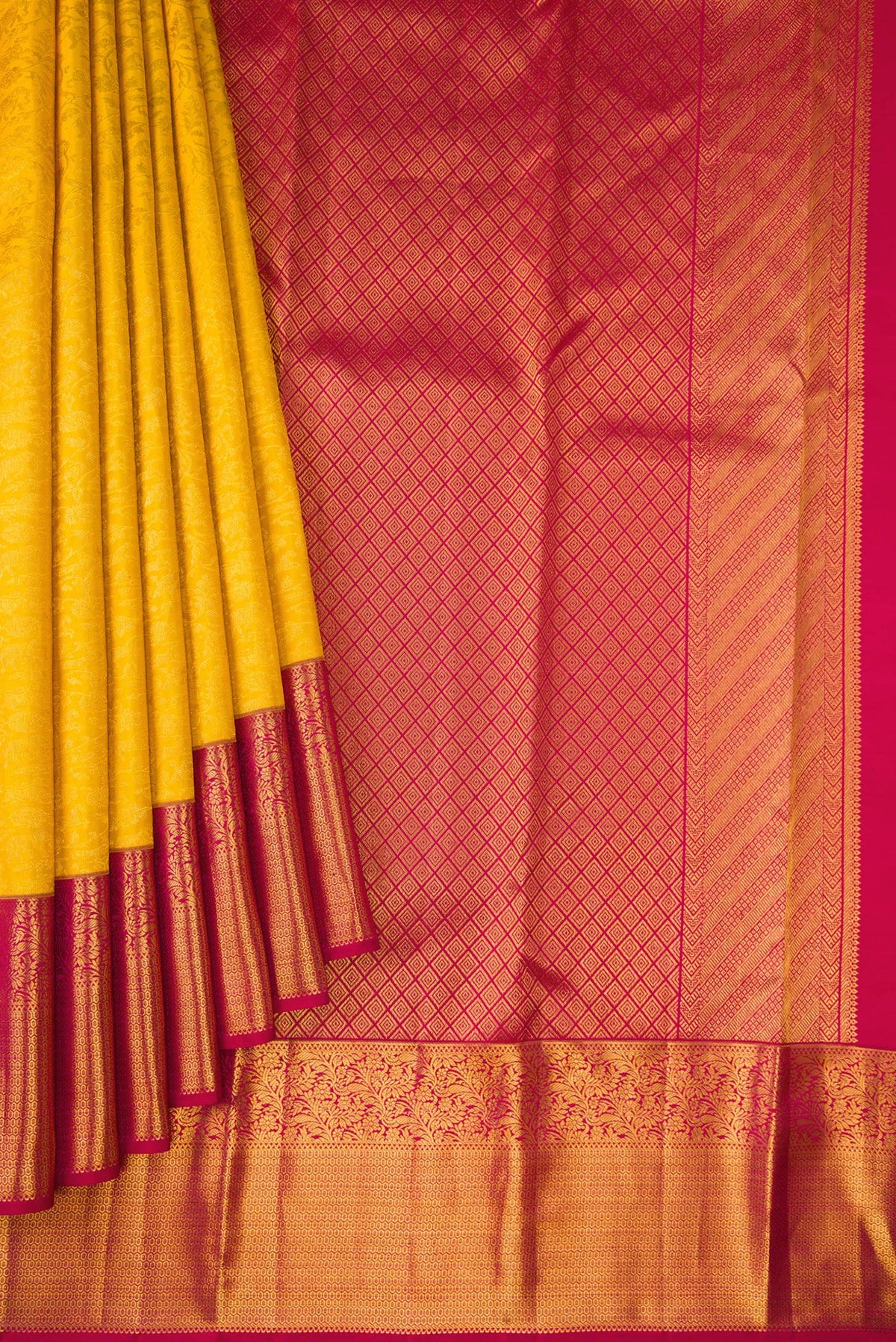 Pleats and pallu of Yellow Kanchipuram Silk Saree with Zari Brocade on the body and Zari Border. 