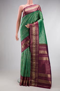 Sea Green Dual Tone Kanchipuram Silk Saree with Zari Brocade on the body and Zari Border.  displayed on a mannequin
