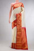 Off White Dual Tone Kanchipuram Silk Saree with Zari Brocade on the body and Zari Border.  displayed on a mannequin