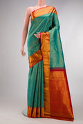 Peacock Blue Dual Tone Kanchipuram Silk Saree with Zari Brocade on the body and Zari Border.  displayed on a mannequin