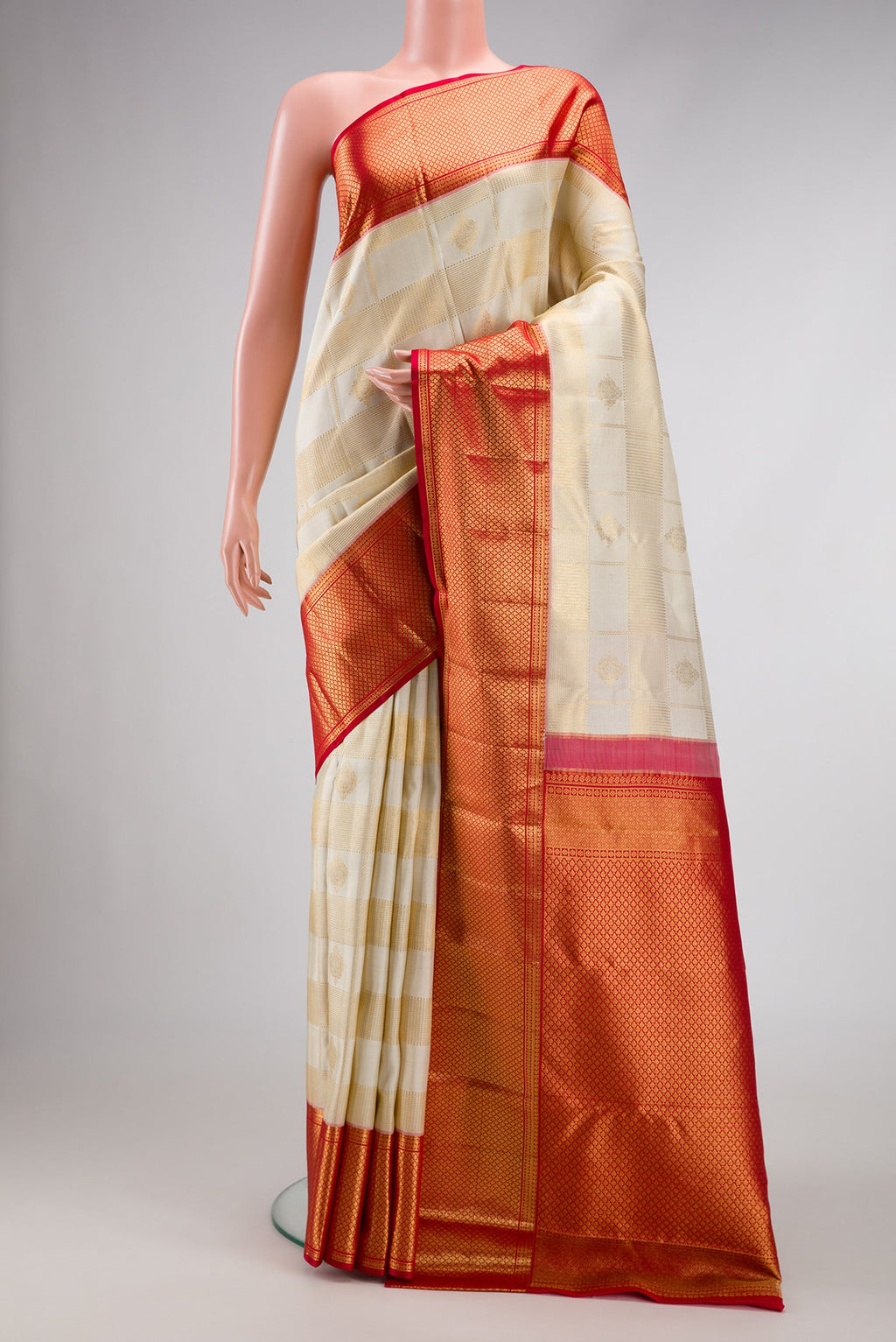 Off White Dual Tone Kanchipuram Silk Saree with Zari Brocade on the body and Zari Border.  displayed on a mannequin