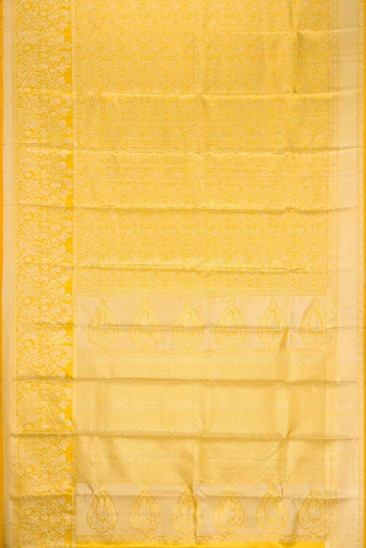 Flat view of Gold Dual Tone Kanjivaram Tissue Silk Saree with Zari Brocade on the body and Zari Border. 