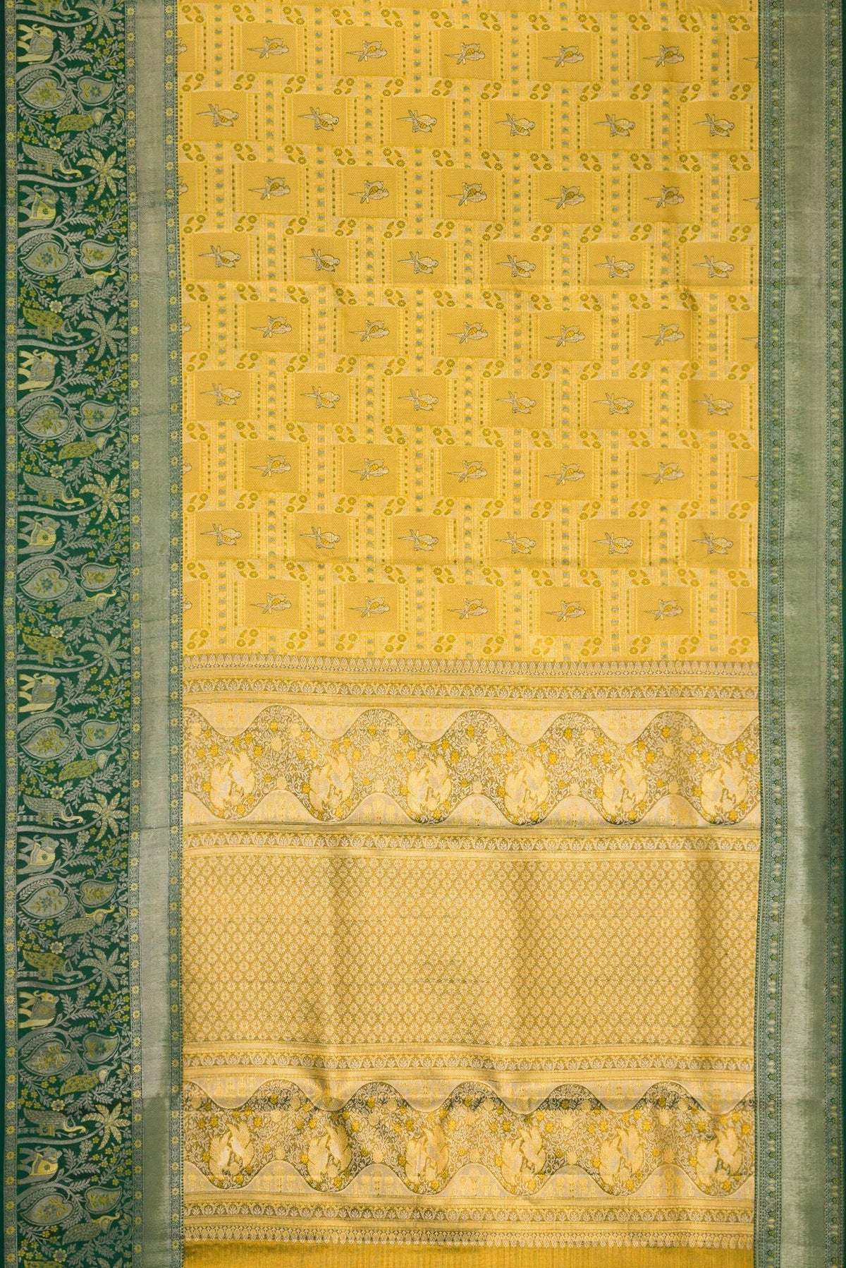 Flat view of Gold Dual Tone Kanjivaram Tissue Silk Saree with Zari Brocade on the body and Zari Border. 