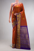Brown Dual Tone Kanjivaram Silk Saree with Zari Butta on the body and Zari Border.  displayed on a mannequin