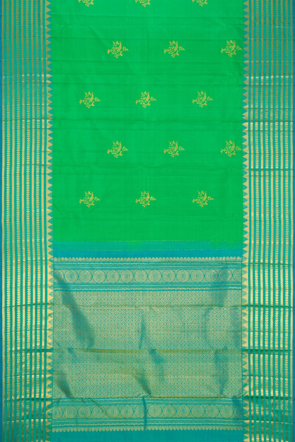Flat view of Green Dual Tone Kanchipuram Silk Saree with Zari Butta on the body and Zari Border. 