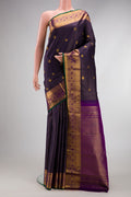 Navy Blue Dual Tone Kanjivaram Silk Saree with Checked design on the body and Zari Border.  displayed on a mannequin