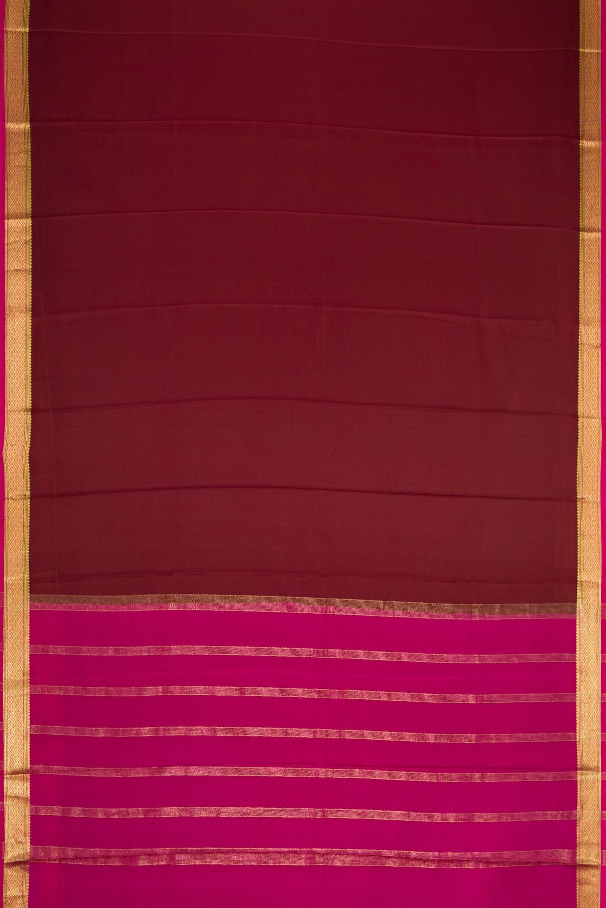 Brown Dual Tone Mysore Crepe Saree with Plain Body and Zari Border.  displayed on a mannequin